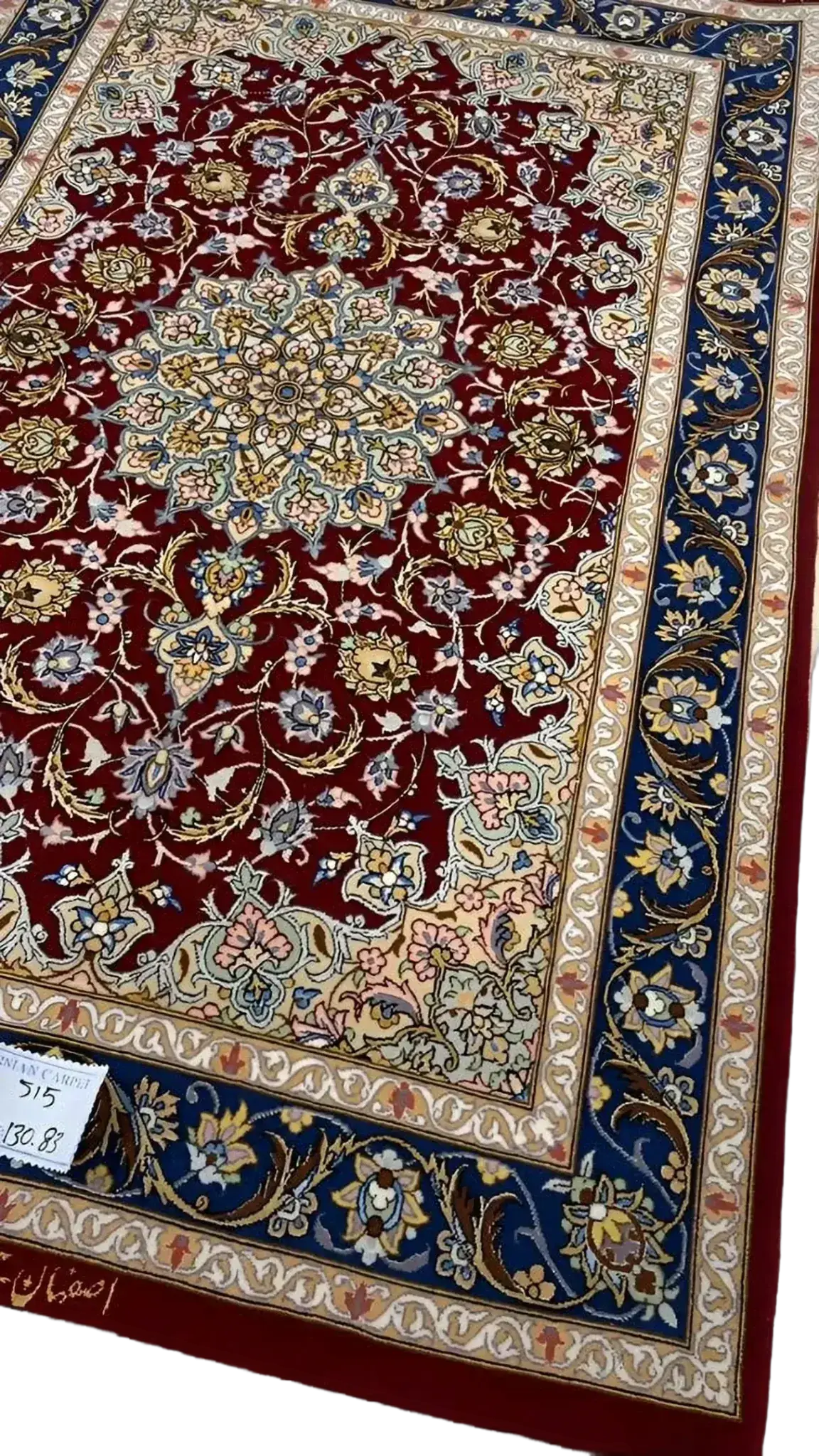 Exquisite dark red Persian rug with traditional medallion design, knotted by hand using high-quality wool and silk for timeless elegance.